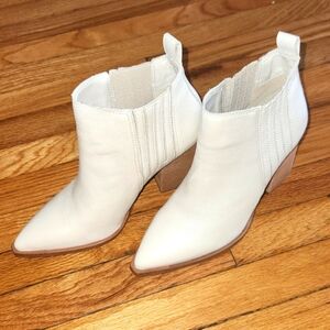 A cute white bottie not worn but I did try on few times can seem to style it